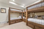 Queen over Queen bunks provide lots of sleeping space in the open bunk room